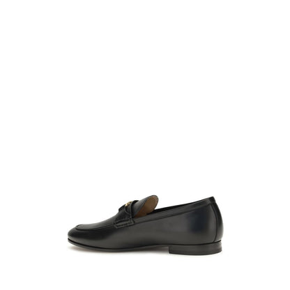 Loafer Slip-On Shoes by Valentino Garavani for men in bos taurus calf leather black, gold & signature showcases a impeccable silhouette as V Logo Men's Bos Taurus Calf Leather Loafer Slip-On Shoes, artfully designed with a impeccable and refined for a impeccable finish.