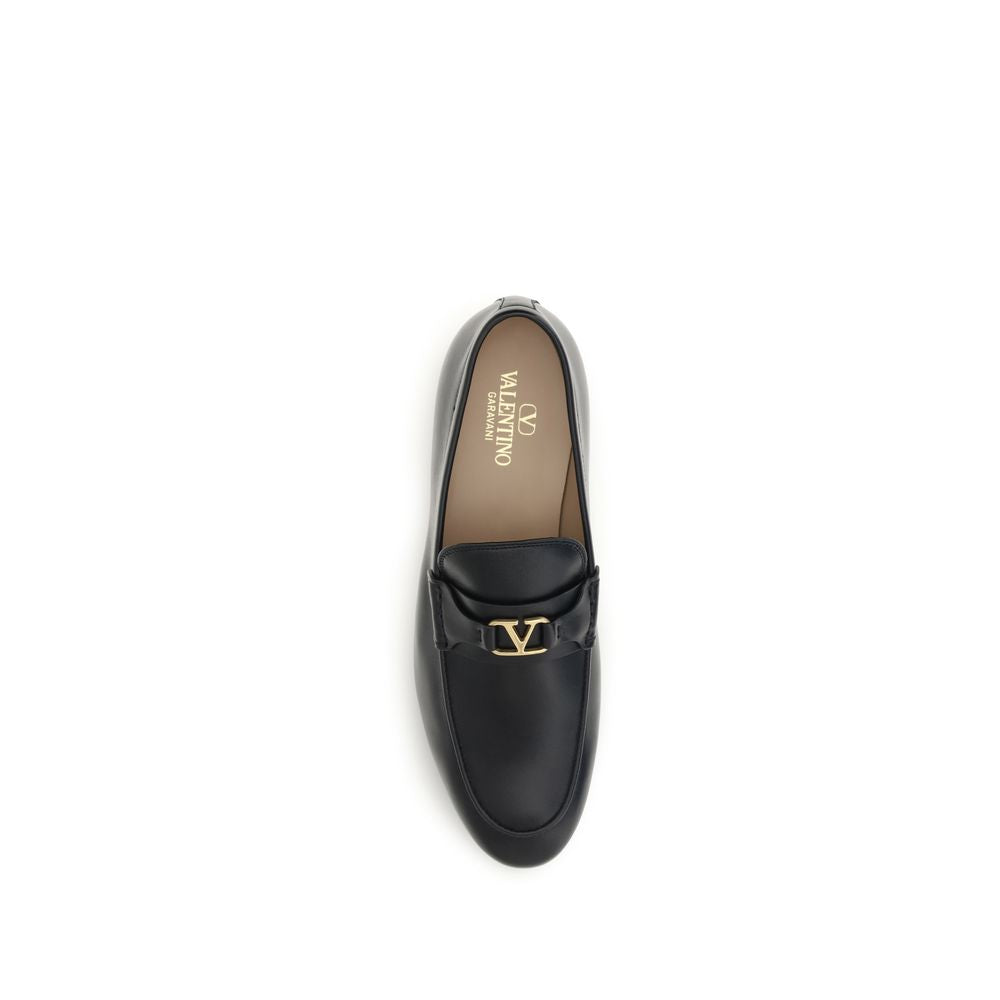 This Loafer Slip-On Shoes by Valentino Garavani for men in bos taurus calf leather black, gold & signature features an exquisite silhouette from the V Logo Men's Bos Taurus Calf Leather Loafer Slip-On Shoes collection, defined by a sophisticated and elegant .