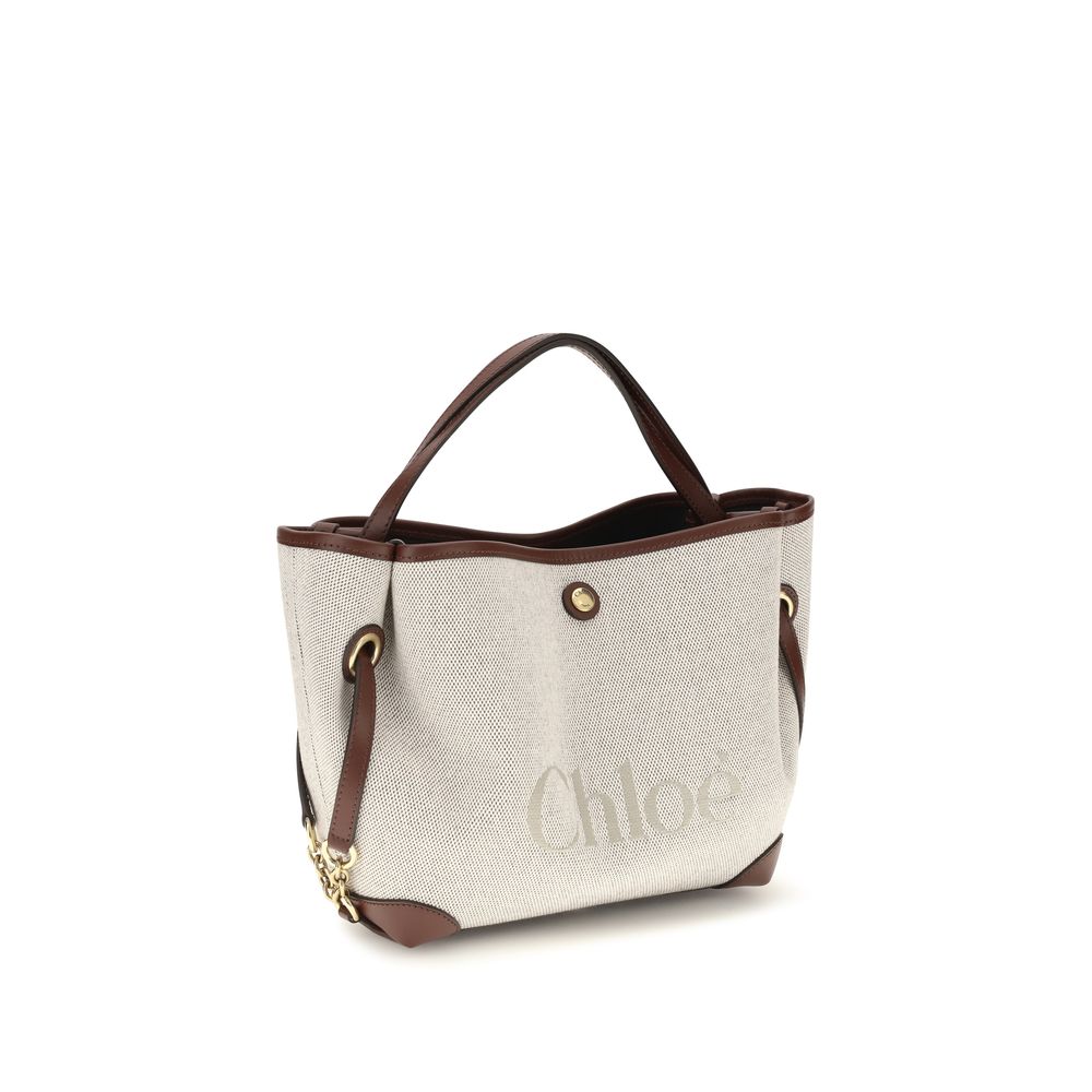 Handbag by Chloé for women in modal & cotton beige & jacquard features an refined silhouette, showcasing a secure magnetic & button, ample , and versatile shoulder-strap, handle & adjustable-strap for a sophisticated refined aesthetic.