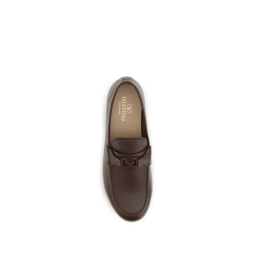 Loafer Slip-On Shoes by Valentino Garavani for men in leather brown & signature features an dynamic silhouette from the V Logo Men's Leather Loafer Slip-On Shoes collection, defined by a dynamic and for a dynamic look.
