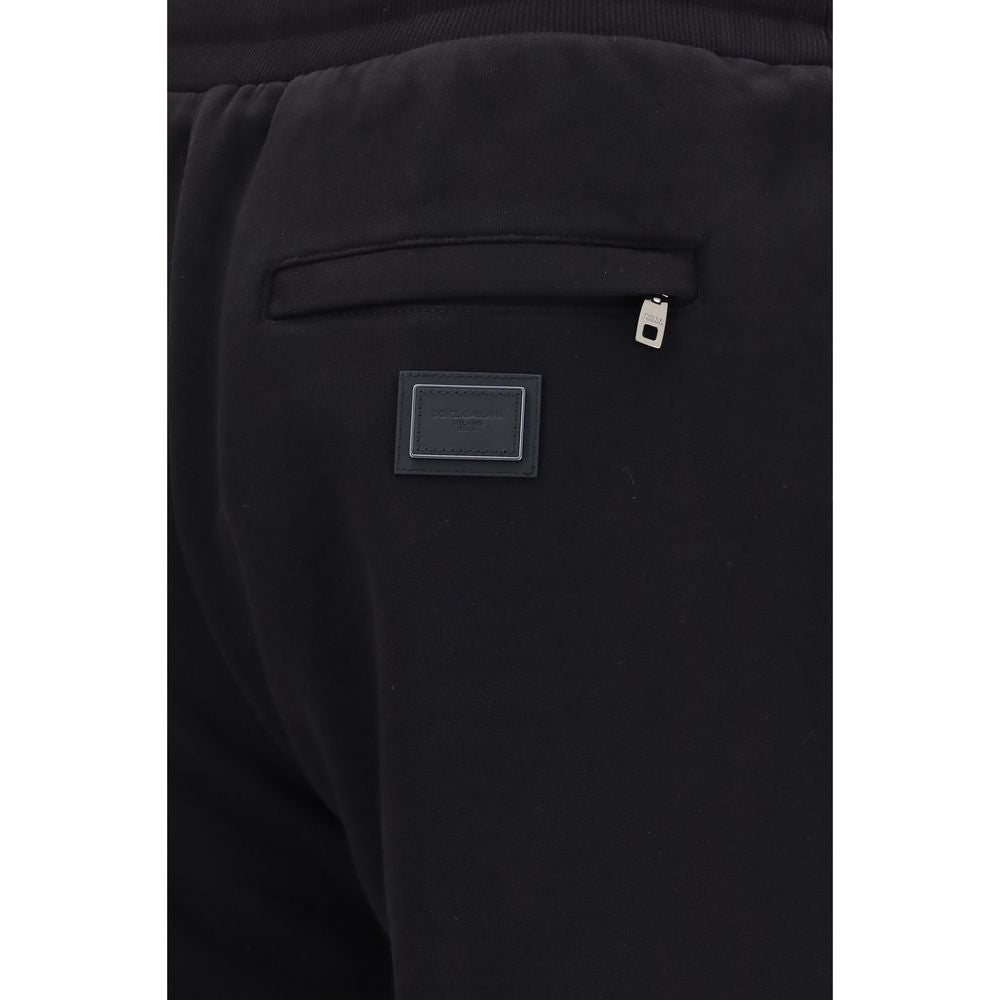 Jogger Sweatpants by Dolce & Gabbana for men in cotton black features a contemporary silhouette with , a contemporary straight-leg & regular-fit, long hem, and for a premium, high-performance aesthetic.