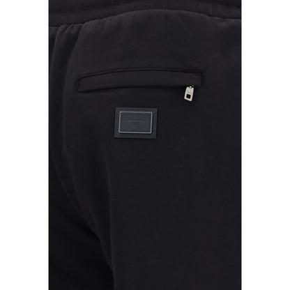 Jogger Sweatpants by Dolce & Gabbana for men in cotton black features a contemporary silhouette with , a contemporary straight-leg & regular-fit, long hem, and for a premium, high-performance aesthetic.