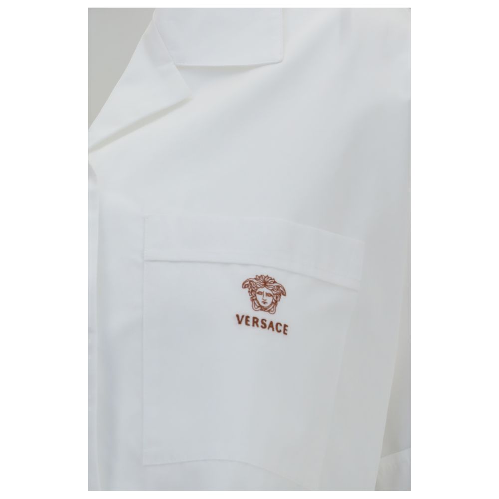 Dress Shirt by Versace for women in cotton white features an architectural silhouette with a refined and elegant for a architectural look.