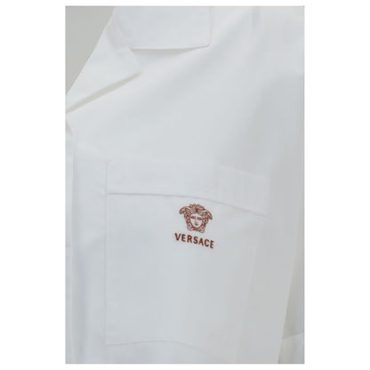 Dress Shirt by Versace for women in cotton white features an architectural silhouette with a refined and elegant for a architectural look.