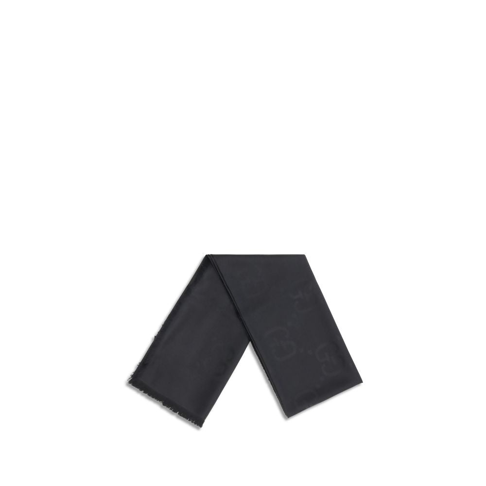 Scarf by Gucci for women in wool & silk black, patterned & jacquard features a snug silhouette, perfectly showcasing the elegant drape and premium finish of the Gg Wool & Silk Frayed-Edge Scarf.