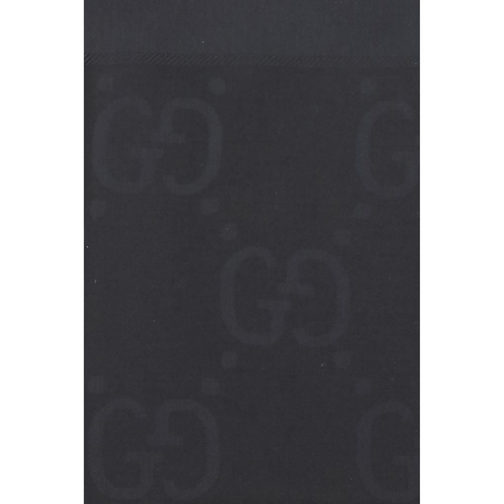 Scarf by Gucci for women in wool & silk black, patterned & jacquard presents a cosy silhouette, artfully capturing the sophisticated design and premium aesthetic of the Gg Wool & Silk Frayed-Edge Scarf.