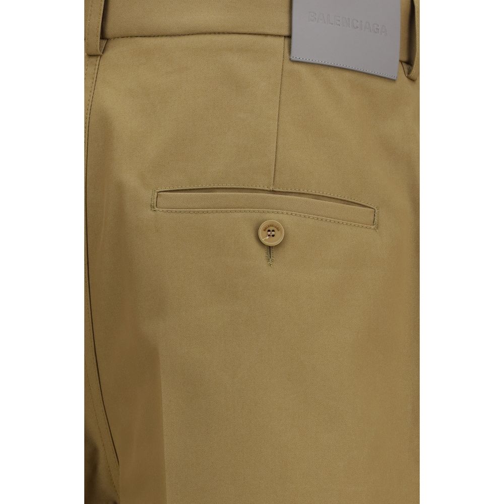 Chinos Pants by Balenciaga for men in cotton twill & leather beige & gray presents a sartorial luxe silhouette, showcasing a sophisticated regular-fit & wide with a long and for a premium, sartorial luxe finish.