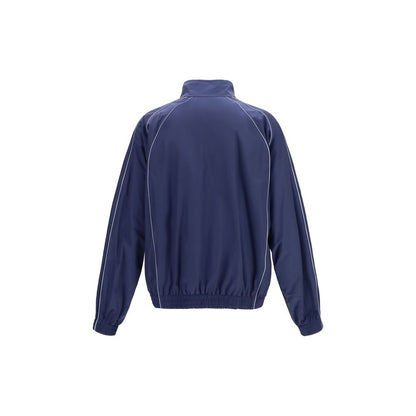 Track Jacket by Balenciaga for men in polyamide cotton blue & signature features an relaxed-luxury silhouette, showcasing a sophisticated high-neck neckline and premium pockets & windproof for a truly relaxed-luxury look.