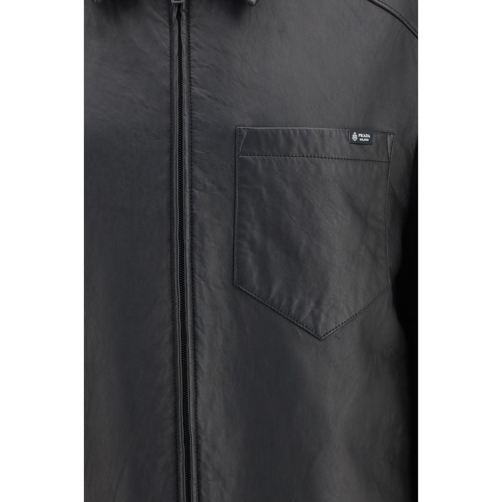 This Jacket by Prada for men in nappa leather black & signature showcases a magnificent silhouette, meticulously crafted with a distinctive and functional pockets for a magnificent finish.