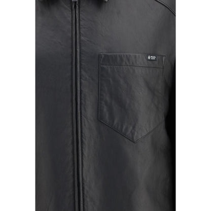 This Jacket by Prada for men in nappa leather black & signature showcases a magnificent silhouette, meticulously crafted with a distinctive and functional pockets for a magnificent finish.