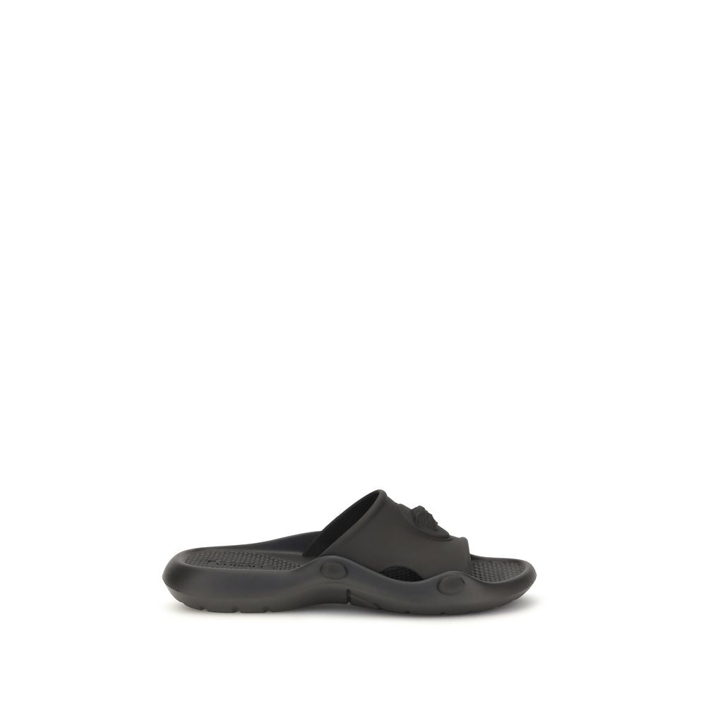Slider Sandals by Versace for men in rubber black showcases a sculptural silhouette as Medusa Men's Rubber Slider Sandals, defined by a sculptural and sculptural for a sculptural look.