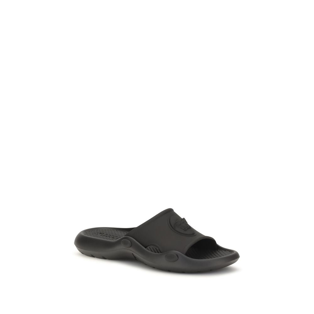 Slider Sandals by Versace for men in rubber and black presents a captivating silhouette, showcasing the signature style of the Medusa Men's Rubber Slider Sandals with a captivating and captivating .