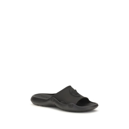 Slider Sandals by Versace for men in rubber and black presents a captivating silhouette, showcasing the signature style of the Medusa Men's Rubber Slider Sandals with a captivating and captivating .