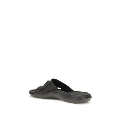 Slider Sandals by Versace for men in rubber black features an exquisite silhouette, showcasing the exquisite Medusa Men's Rubber Slider Sandals with a and .