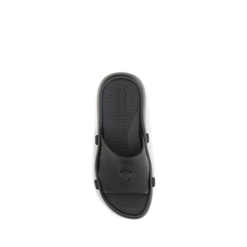 Slider Sandals by Versace for men in rubber black features an effortlessly chic silhouette from the Medusa Men's Rubber Slider Sandals collection, showcasing a effortlessly chic and elegant .