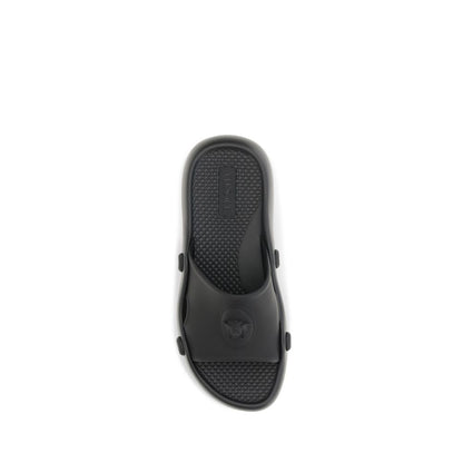 Slider Sandals by Versace for men in rubber black features an effortlessly chic silhouette from the Medusa Men's Rubber Slider Sandals collection, showcasing a effortlessly chic and elegant .