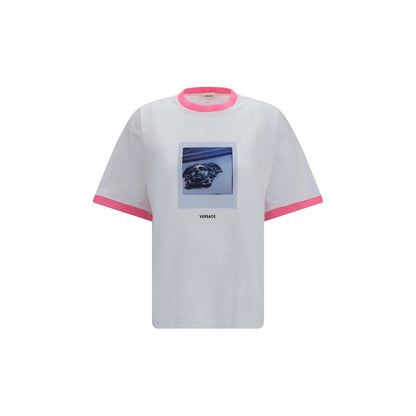 T-Shirt by Versace for women in cotton white & print showcases a fashionable silhouette, elegantly detailed with a fashionable short-sleeve and crew neckline for a sophisticated, high-fashion look.