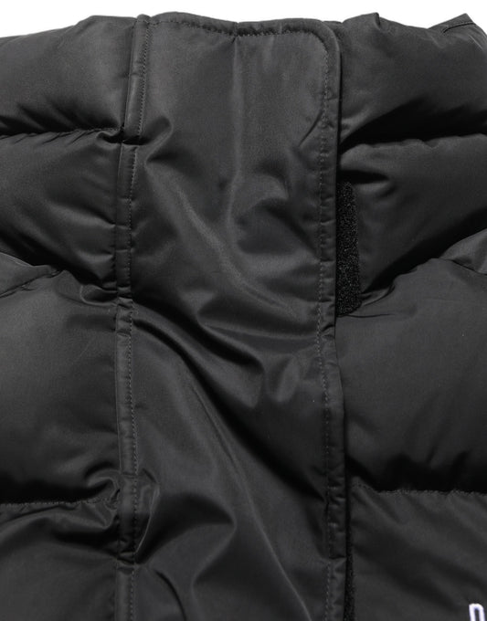 Puffer Jacket by Dolce & Gabbana for women in nylon & polyester black showcases a bohemian silhouette, artfully detailed with a bohemian wrap neckline and signature insulated & windproof for a truly bohemian finish.