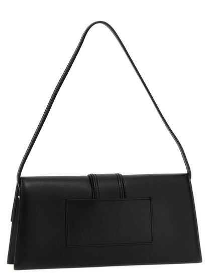 Shoulder Flap Bag by Jacquemus for women in bos taurus calf suede leather black presents a statuesque silhouette, showcasing a secure flap & magnetic and statuesque with versatile shoulder-strap for a sophisticated look.