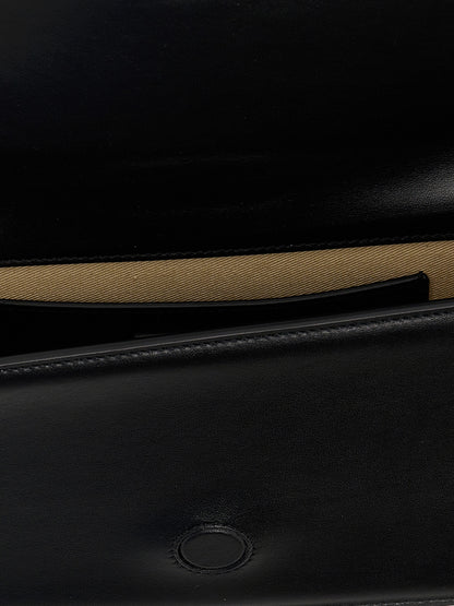 Shoulder Flap Bag by Jacquemus for women in bos taurus calf suede leather black features a statuesque silhouette, showcasing a secure flap & magnetic and statuesque with versatile shoulder-strap for a statuesque finish.