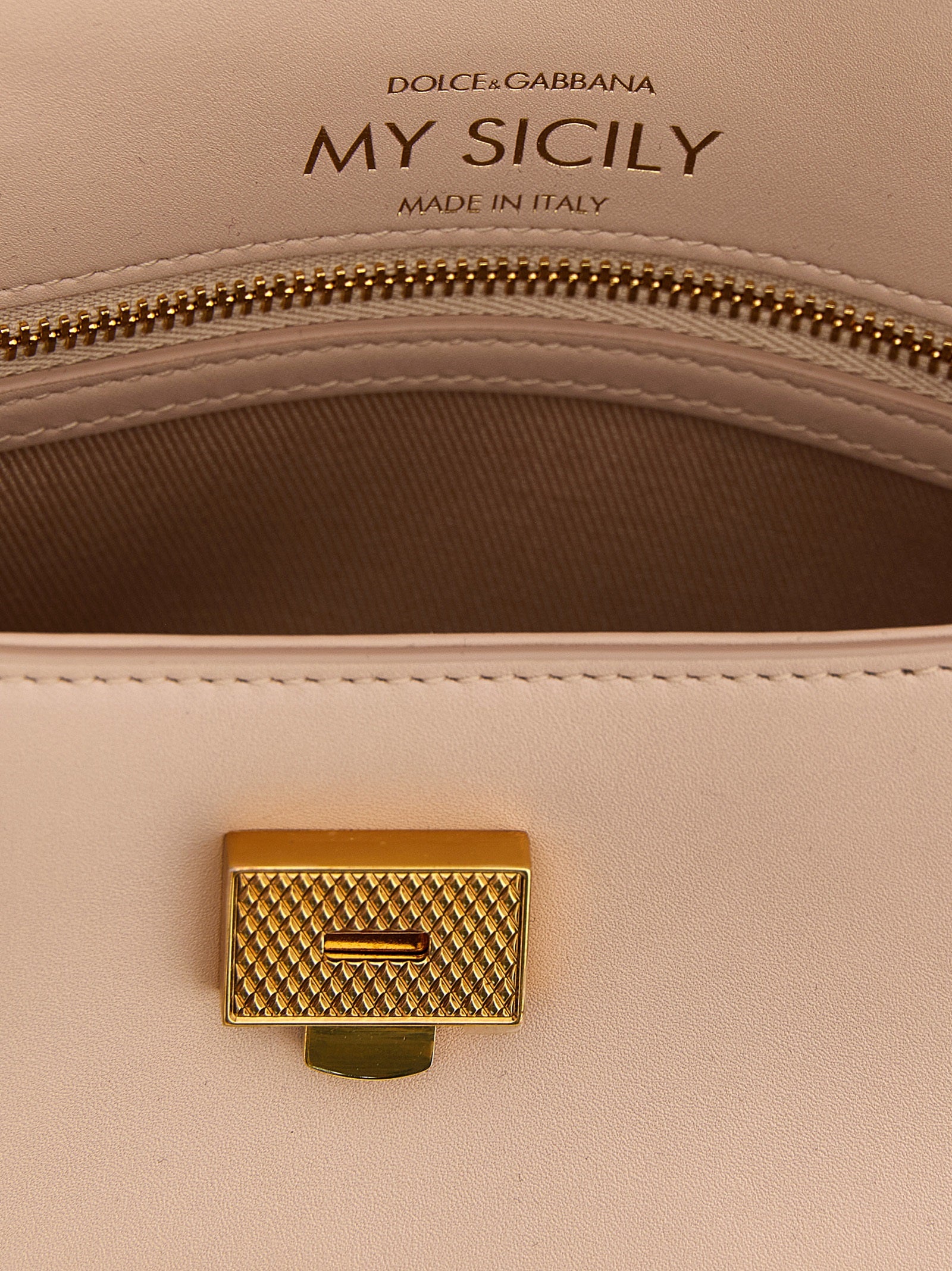 This Mini Flap Handbag by Dolce & Gabbana for women in bos taurus calf suede leather and multicolor & pink presents a sculptural silhouette featuring a secure flap, ample , and versatile shoulder-strap, adjustable-strap & handle for a sculptural finish.