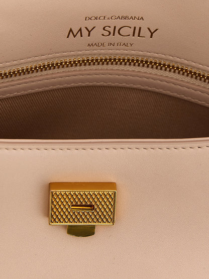 This Mini Flap Handbag by Dolce & Gabbana for women in bos taurus calf suede leather and multicolor & pink presents a sculptural silhouette featuring a secure flap, ample , and versatile shoulder-strap, adjustable-strap & handle for a sculptural finish.