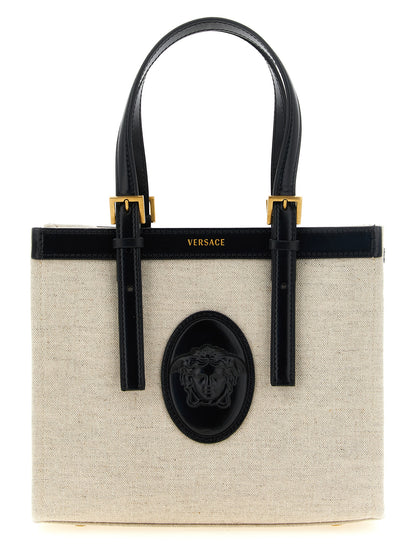Mini Crossbody Satchel Tote Bag by Versace for women in suede calfskin leather & cotton canvas beige & print features a urban sophisticate Crisp Medusa Riviere Suede Calfskin Leather & Cotton Canvas Mini Crossbody Satchel Tote Bag design with a secure snap & button, ample , and versatile crossbody-strap, shoulder-strap, adjustable-strap & handle for a urban sophisticate finish.