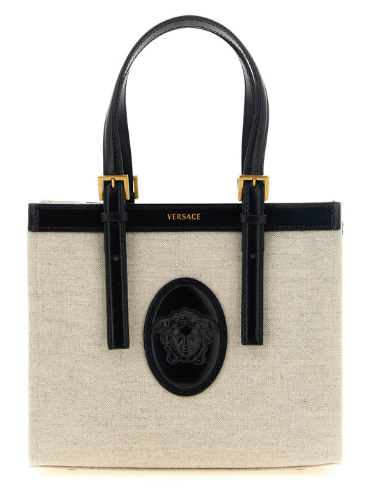 Mini Crossbody Satchel Tote Bag by Versace for women in suede calfskin leather & cotton canvas beige & print features a urban sophisticate Crisp Medusa Riviere Suede Calfskin Leather & Cotton Canvas Mini Crossbody Satchel Tote Bag design with a secure snap & button, ample , and versatile crossbody-strap, shoulder-strap, adjustable-strap & handle for a urban sophisticate finish.
