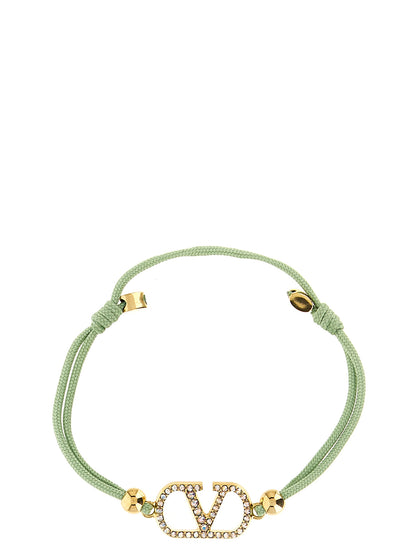 Bracelet by Valentino Garavani for women in cotton and bicolour, green & signature showcases a refined silhouette, artfully capturing the essence of V Logo Women's Polyester Cotton & Crystal Bracelet with its refined .