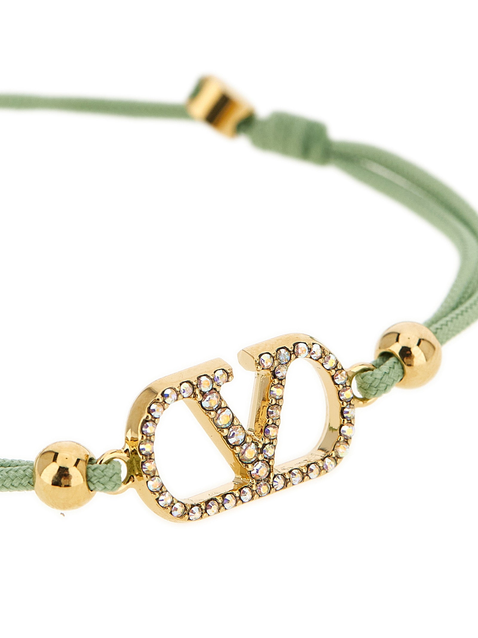 Bracelet by Valentino Garavani for women in cotton and bicolour, green & signature showcases a refined silhouette, artfully capturing the essence of V Logo Women's Polyester Cotton & Crystal Bracelet with its refined .