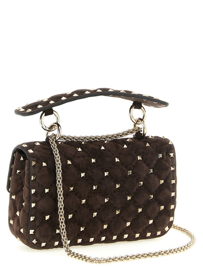 Small Shoulder Flap Bag by Valentino Garavani for women in suede calfskin leather brown features a effortless chic silhouette with a secure flap, ample , and versatile shoulder-strap, detachable-strap & handle for a effortless chic finish.