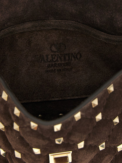 Small Shoulder Flap Bag by Valentino Garavani for women in suede calfskin leather brown features an effortlessly chic silhouette with a secure flap, ample , and versatile shoulder-strap, detachable-strap & handle for effortlessly chic everyday luxury.