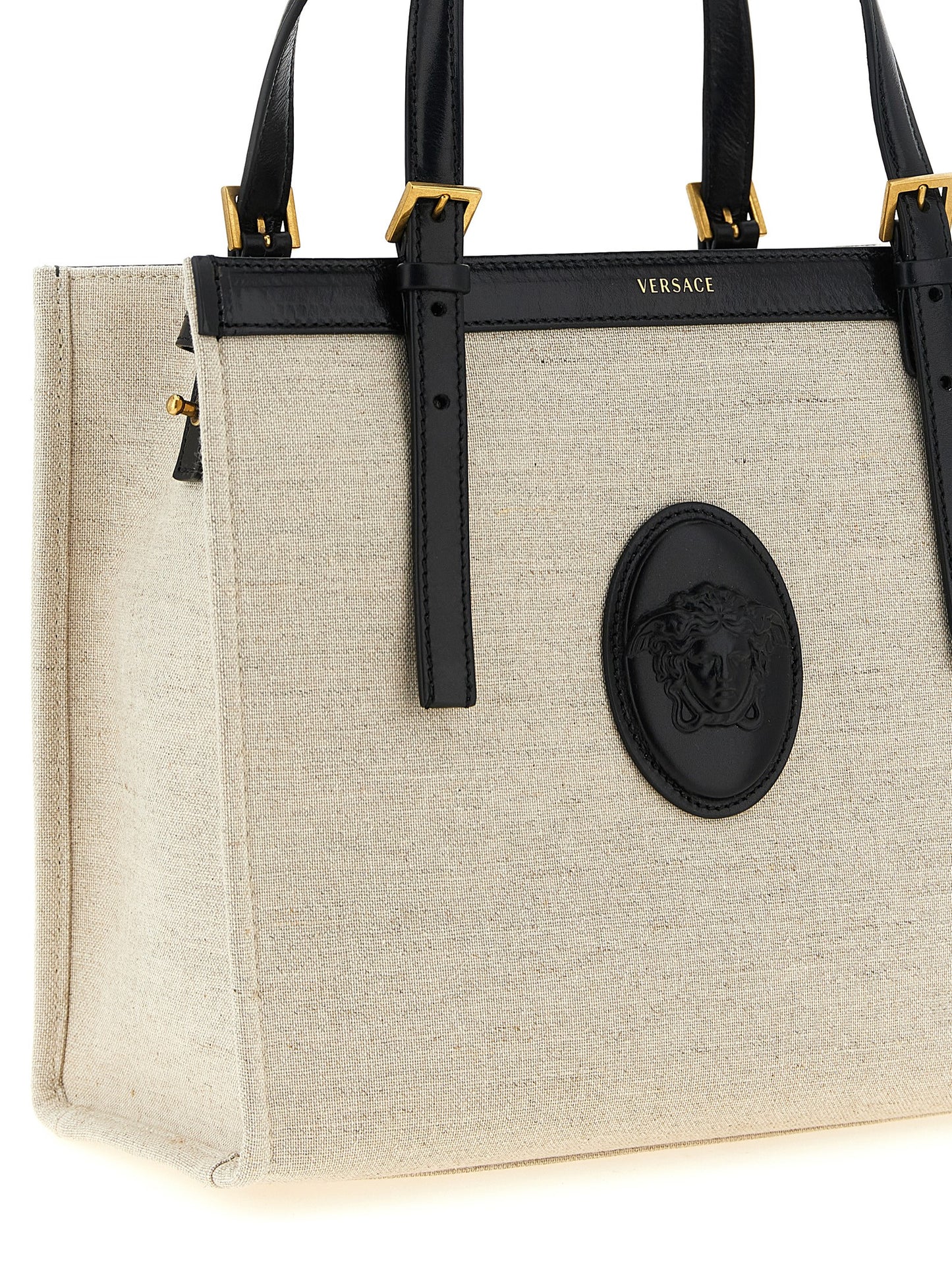 Medium Shopper Tote Bag by Versace for women in suede calfskin leather & cotton canvas beige & print features an utilitarian-chic silhouette, showcasing the Medusa Riviere Suede Calfskin Leather & Cotton Canvas Medium Shopper Tote Bag design with a secure , ample built-in-compartments, and versatile shoulder-strap, handle & adjustable-strap.