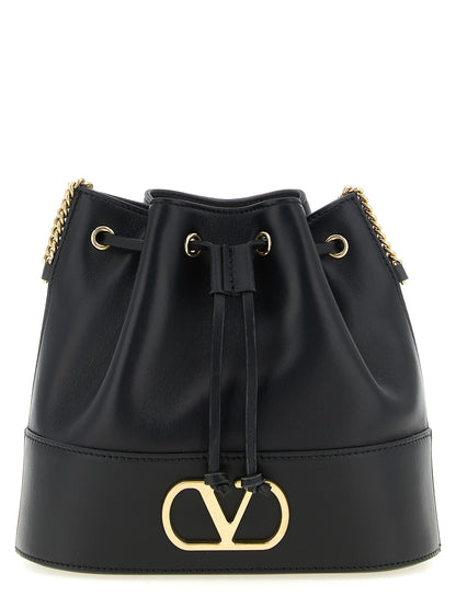 Crossbody Bucket Handbag by Valentino Garavani for women in lamb leather black & signature features a transformative sophistication silhouette, showcasing a secure drawstring, ample , and versatile crossbody-strap & shoulder-strap for a transformative sophistication look.