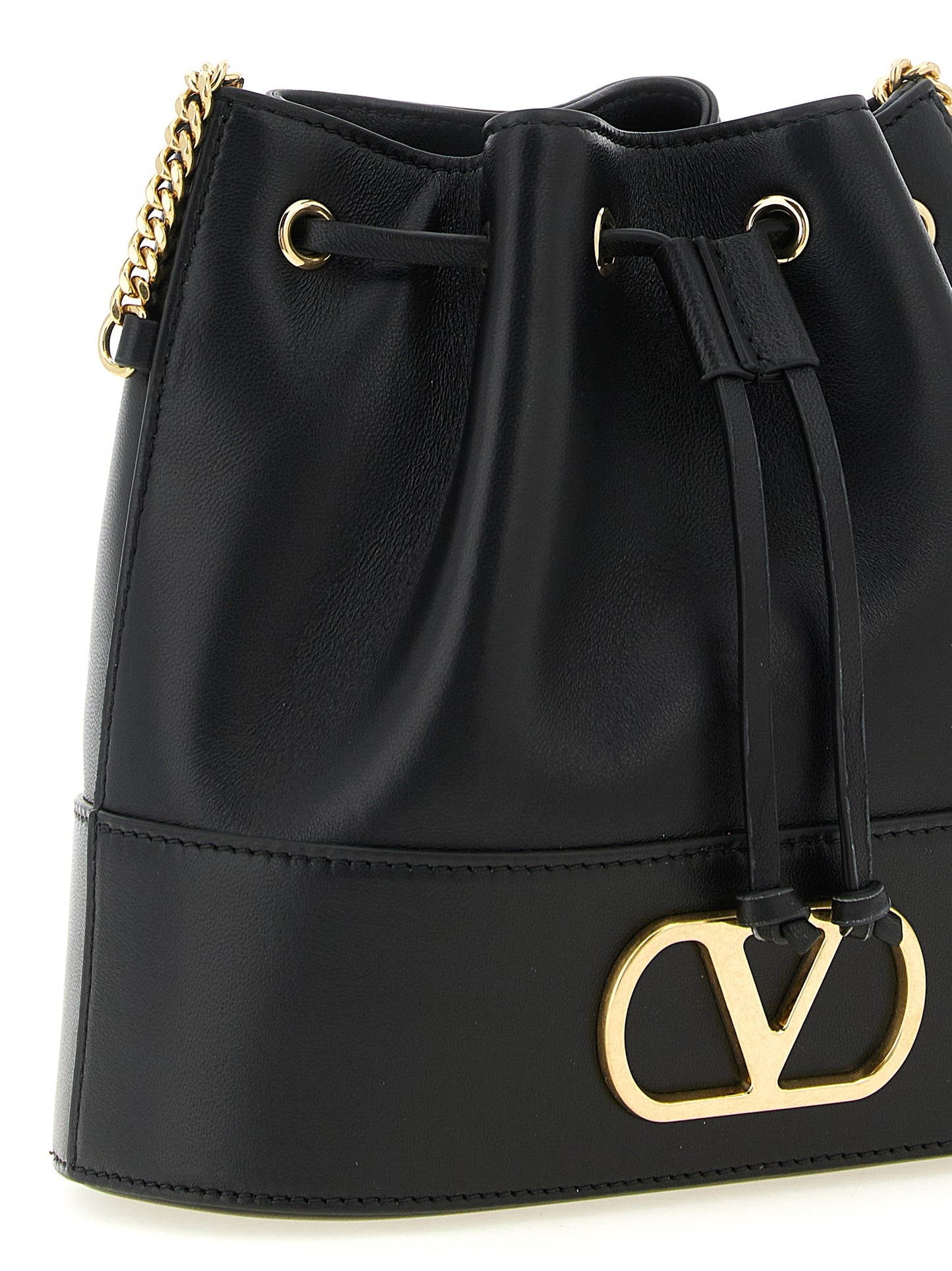 Crossbody Bucket Handbag by Valentino Garavani for women in lamb leather black & signature features an versatile silhouette, showcasing a secure drawstring and versatile with versatile crossbody-strap & shoulder-strap for a versatile finish.