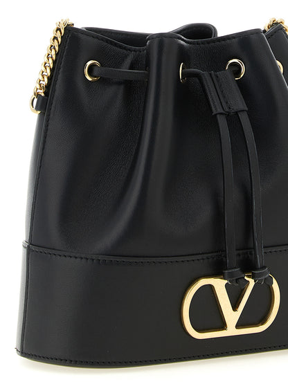 Crossbody Bucket Handbag by Valentino Garavani for women in lamb leather black & signature features an versatile silhouette, showcasing a secure drawstring and versatile with versatile crossbody-strap & shoulder-strap for a versatile finish.