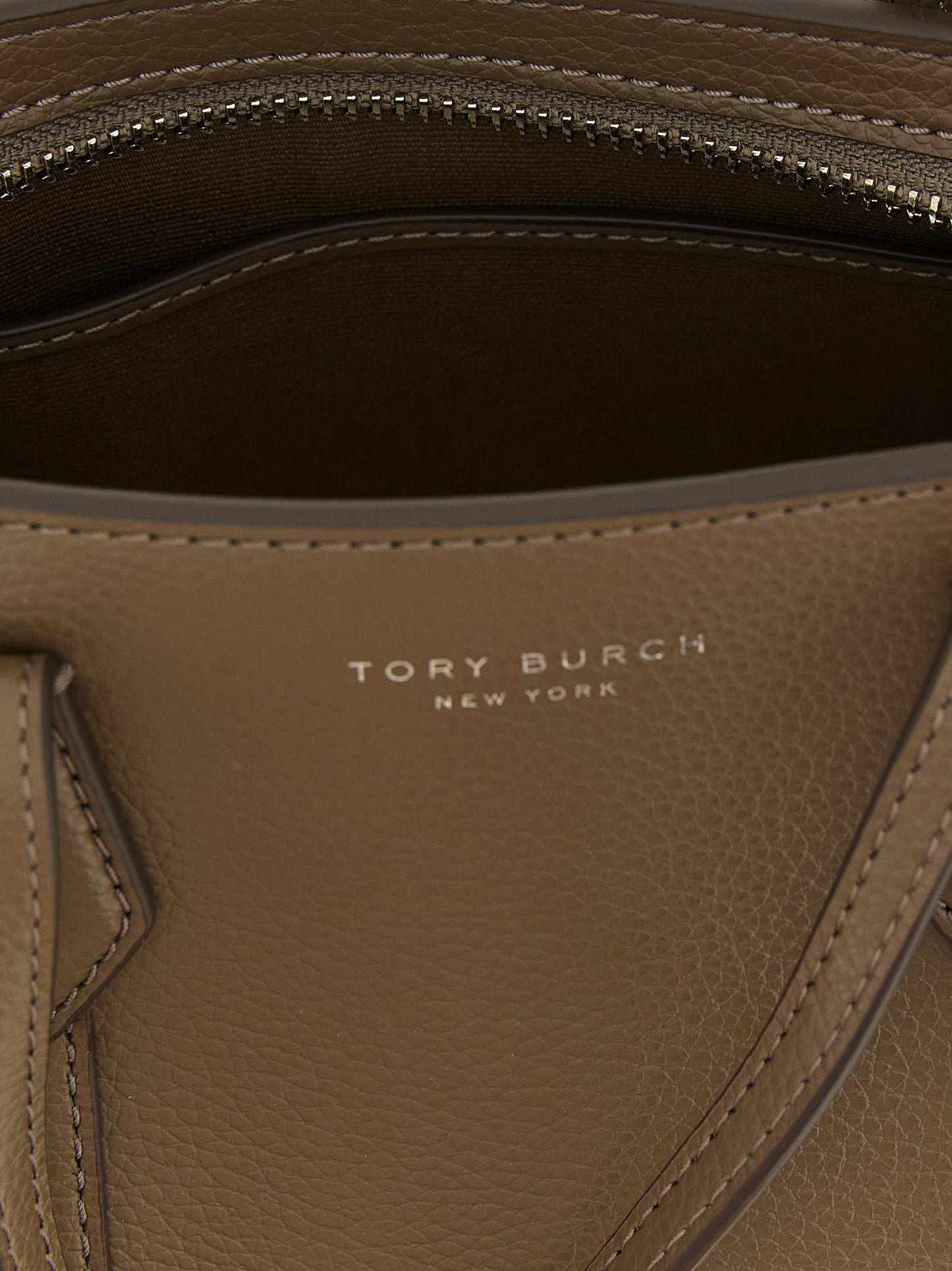 Mini Shopper Tote Bag by Tory Burch for women in leather & cotton brown showcases a urban-chic Perry Leather & Cotton Mini Shopper Tote Bag design, featuring a secure , ample , and versatile shoulder-strap, adjustable-strap & handle for a urban-chic finish.