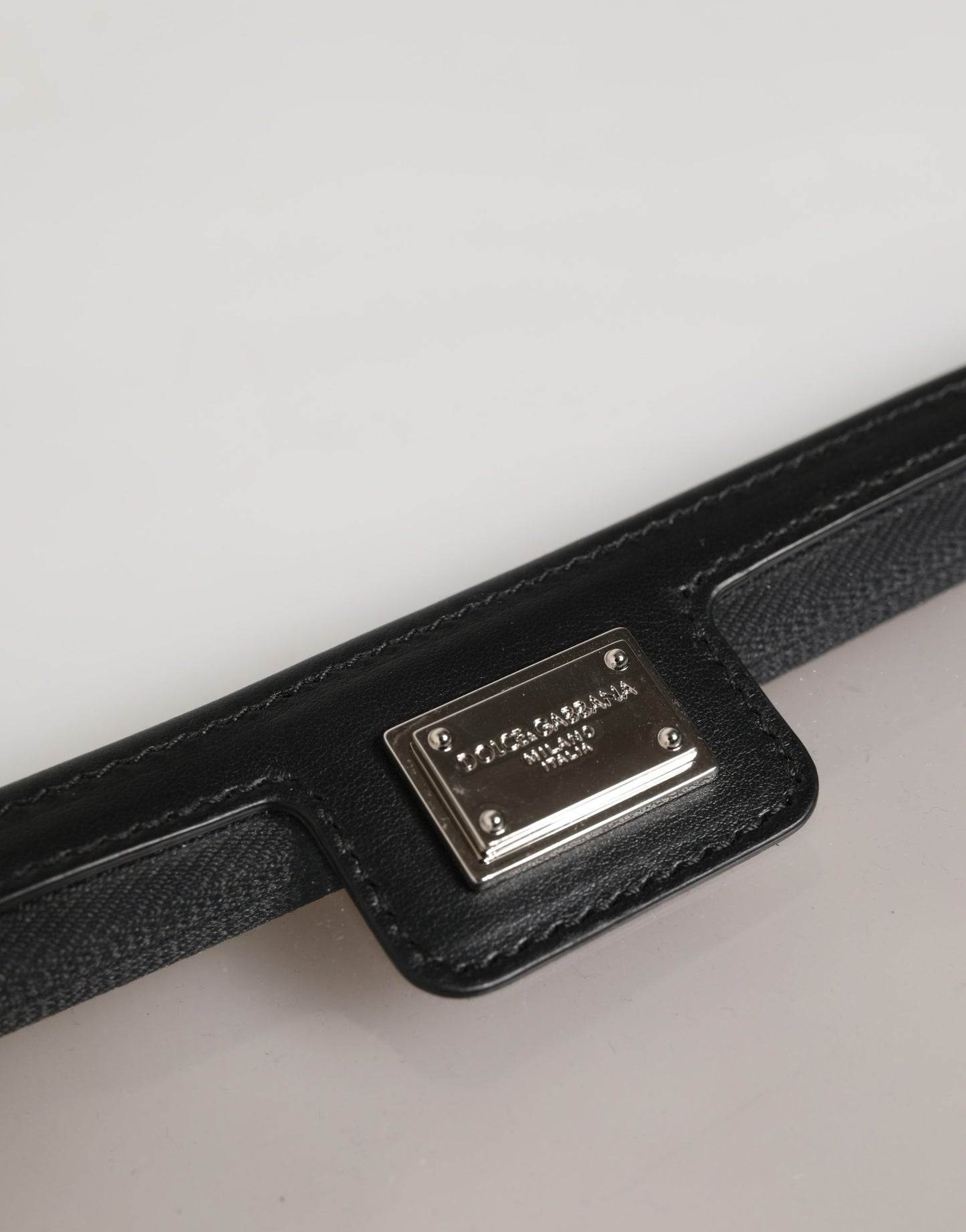 Pouch Clutch Handbag by Dolce & Gabbana for women in pebbled calf leather black, silver & transparent showcases a sculptural silhouette, featuring a secure zipper, ample , and versatile for a sculptural finish.