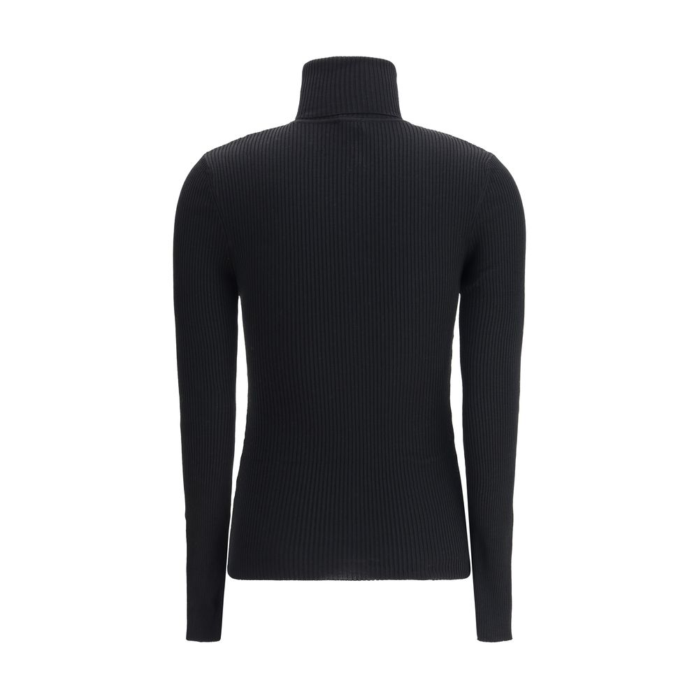Sweater by Wolford for women in wool black showcases a discreet silhouette, finished with a discreet turtle neckline and for a discreet look.