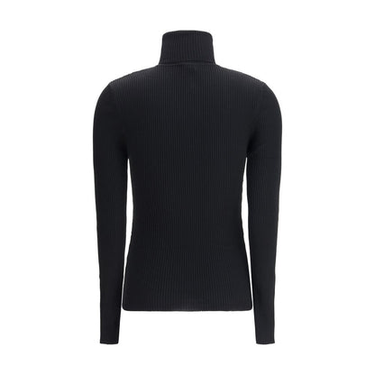 Sweater by Wolford for women in wool black showcases a discreet silhouette, finished with a discreet turtle neckline and for a discreet look.