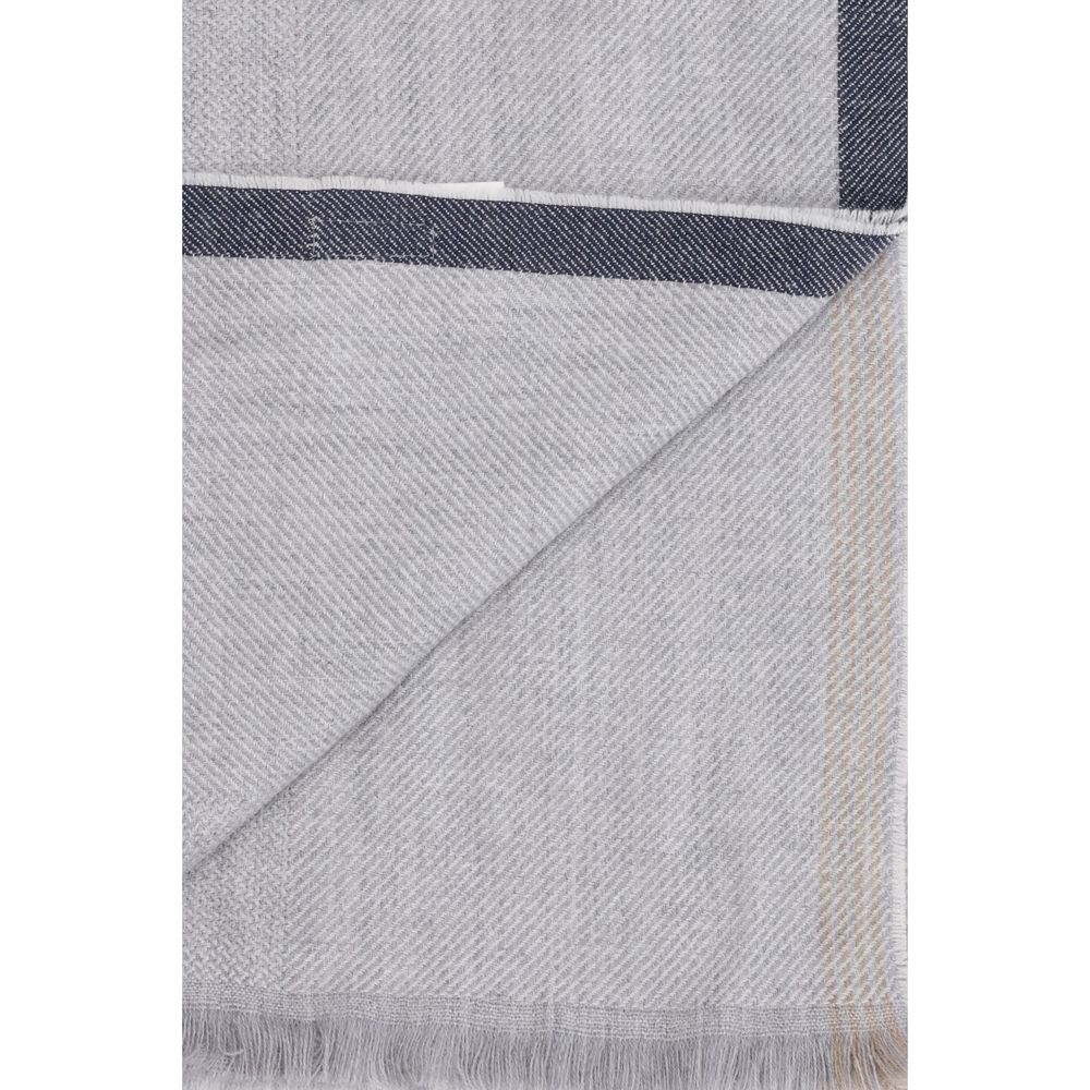 Scarf by Brunello Cucinelli for men in cashmere wool gray & patterned showcases a warm silhouette from the Cashmere Wool Wrap Frayed-Edge Scarf collection, offering a warm drape that exudes sophisticated luxury.