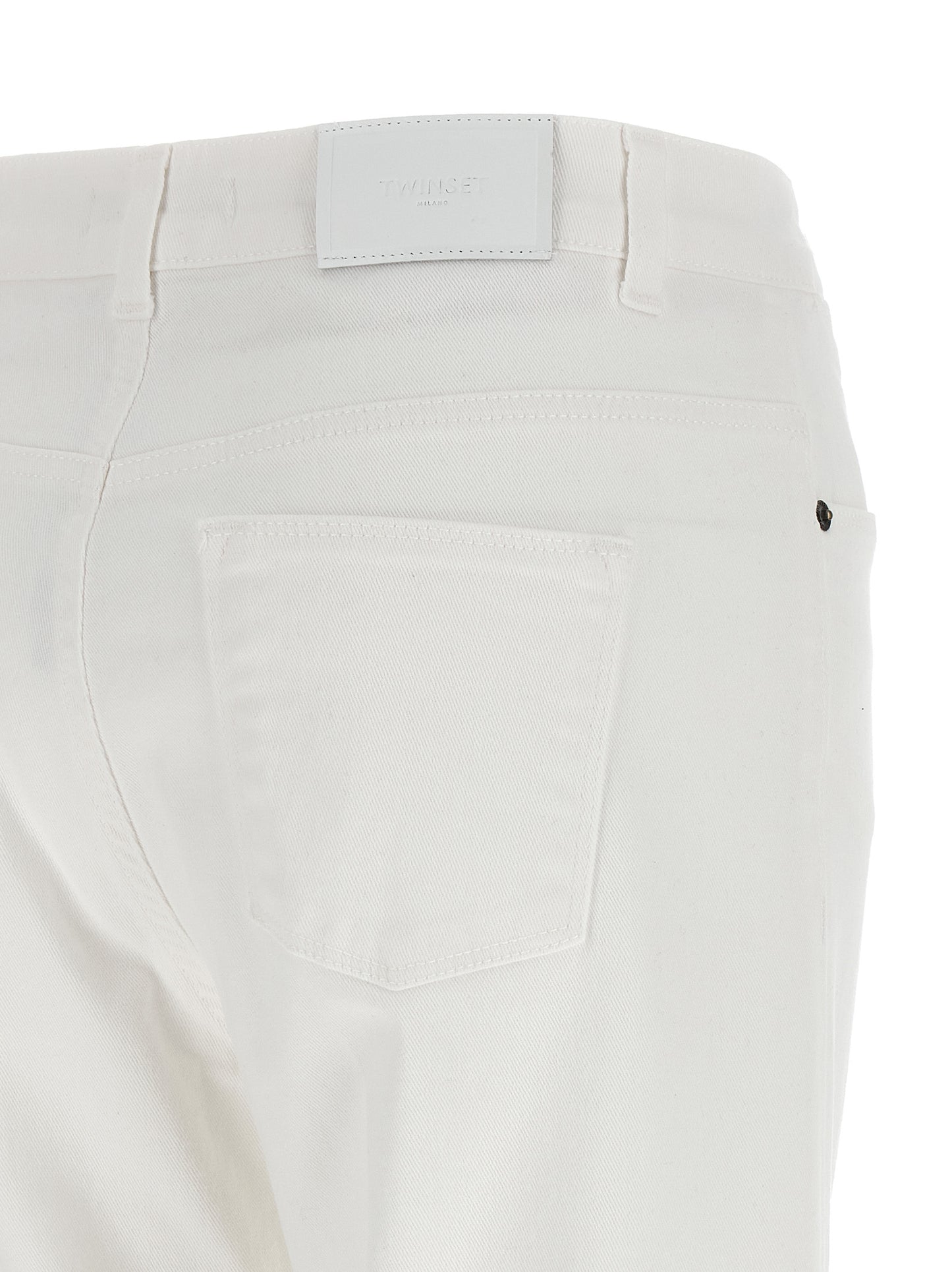 Jeans by Twinset for women in stretch denim cotton white presents a tailored silhouette, showcasing a tailored flared and long cut with a refined for a truly tailored aesthetic.