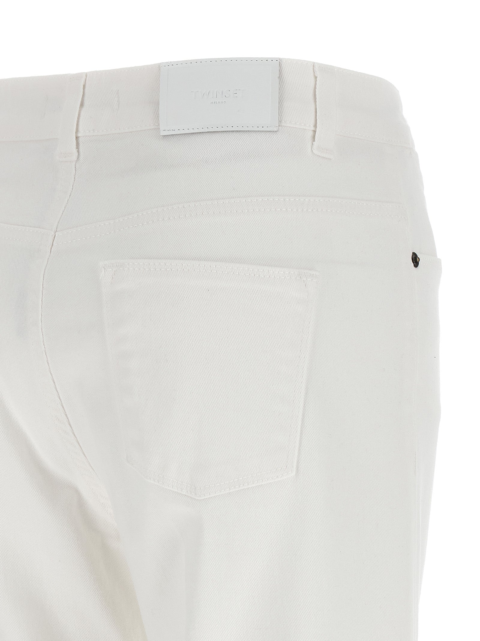 Jeans by Twinset for women in stretch denim cotton white presents a tailored silhouette, showcasing a tailored flared and long cut with a refined for a truly tailored aesthetic.