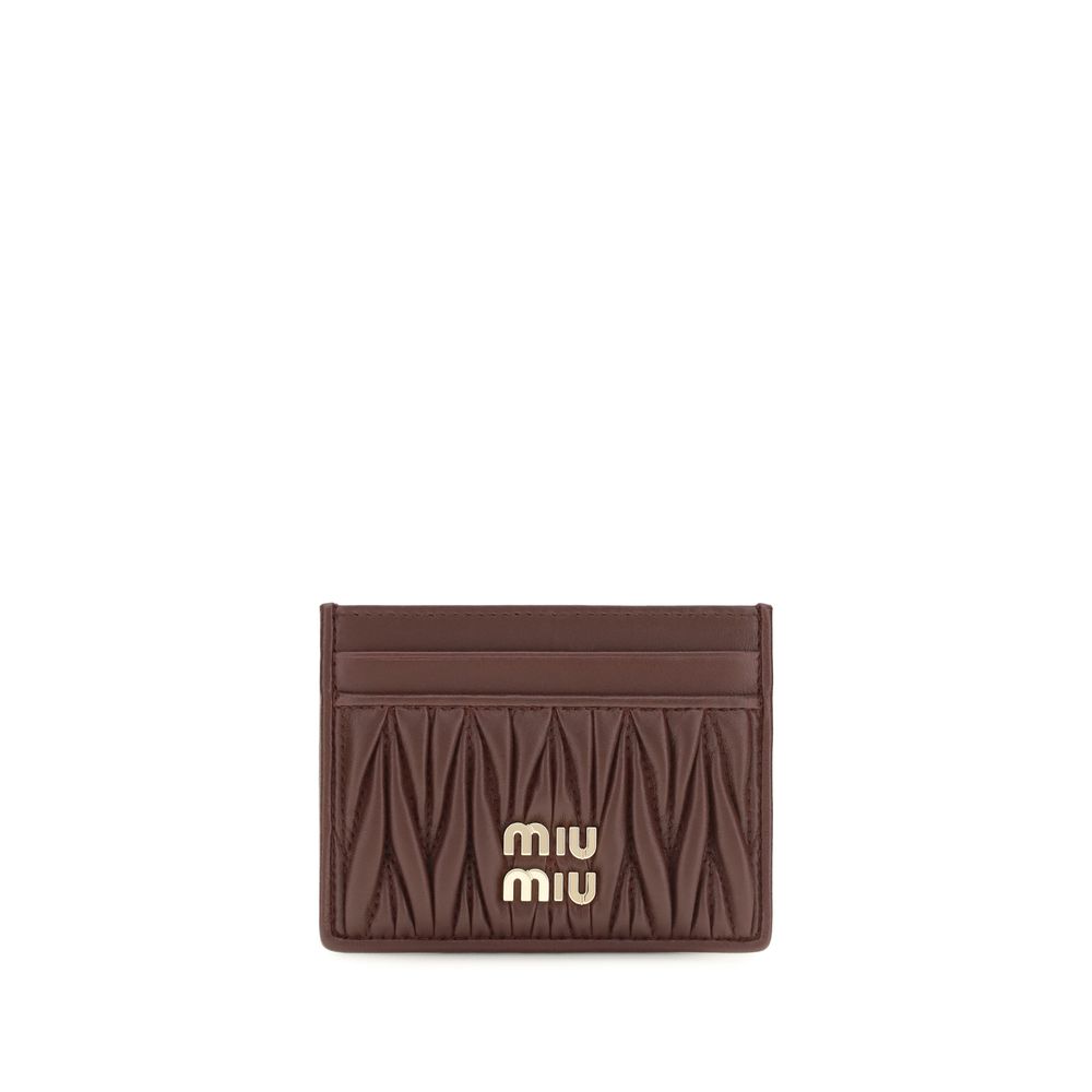 Cardholder Wallet by Miu Miu for women in nappa lamb leather bordeaux showcases a discerning silhouette, artfully capturing the essence of Nappa Lamb Leather Cardholder Wallet with its functional card-organization compact-design.