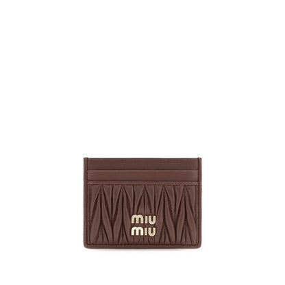 Cardholder Wallet by Miu Miu for women in nappa lamb leather bordeaux showcases a discerning silhouette, artfully capturing the essence of Nappa Lamb Leather Cardholder Wallet with its functional card-organization compact-design.