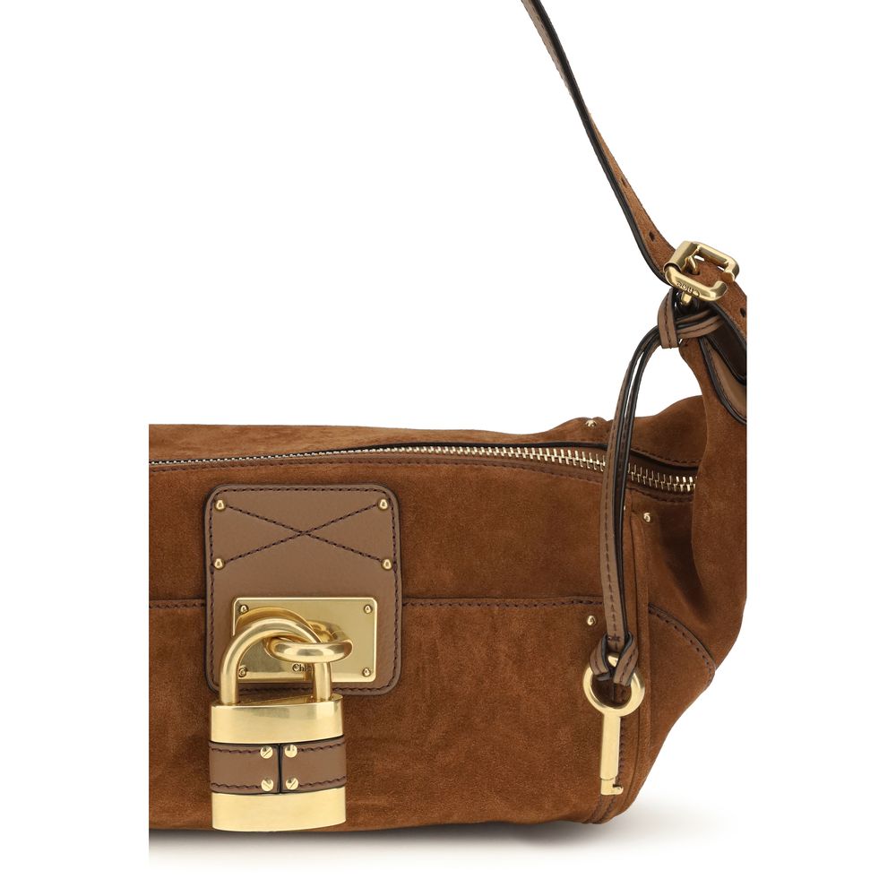 Micro Shoulder Bag by Chloé for women in bos taurus calf nappa & suede leather brown, gold & signature features a enviable silhouette, showcasing a secure zipper & buckle, ample external-pockets, and enviable shoulder-strap & adjustable-strap for a enviable finish.