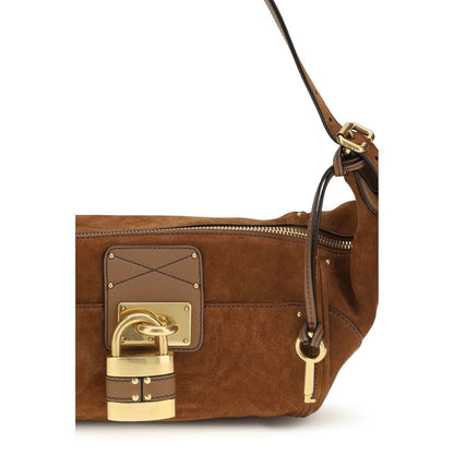 Micro Shoulder Bag by Chloé for women in bos taurus calf nappa & suede leather brown, gold & signature features a enviable silhouette, showcasing a secure zipper & buckle, ample external-pockets, and enviable shoulder-strap & adjustable-strap for a enviable finish.