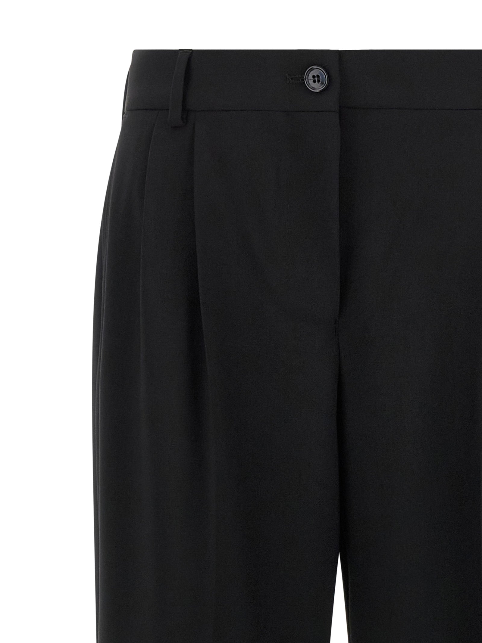 Trousers by Dolce & Gabbana for women in virgin wool black features a tailored silhouette with a tailored flared, defined by its long and a sophisticated mid rise.