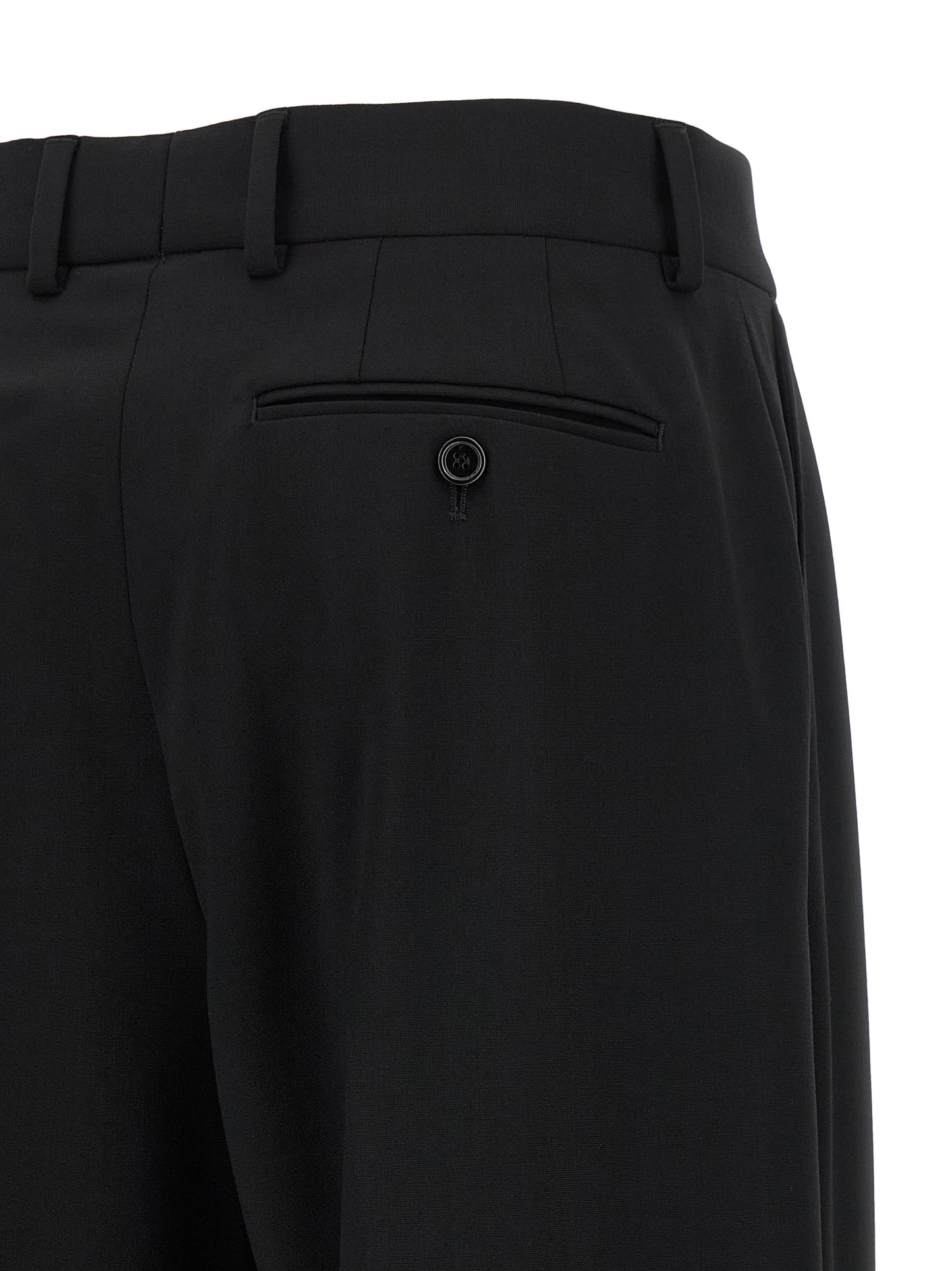 Trousers by Dolce & Gabbana for women in virgin wool black features an sartorial silhouette, showcasing a precise flared and long with a sartorial mid rise for a refined look.