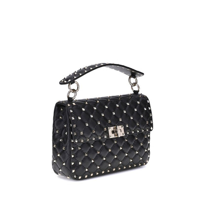 This Small Quilted Crossbody Flap Handbag by Valentino Garavani for women in nappa lambskin leather and black & signature presents a sculptural silhouette featuring a secure flap, ample , and versatile crossbody-strap, adjustable-strap & handle for a sculptural finish.